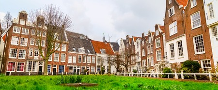 Dutch traditional Holland houses in Amsterdam, Netherlands panoramic bannerの写真素材