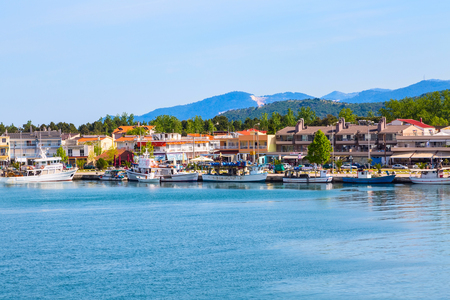 Keramoti, Greece - May 1, 2016: Keramoti port and town panorama with houses and boatsのeditorial素材