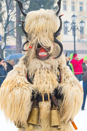 Razlog, Bulgaria - January 14, 2017: People in traditional carnival kuker costumes at Kukeri festival Starchevataのeditorial素材