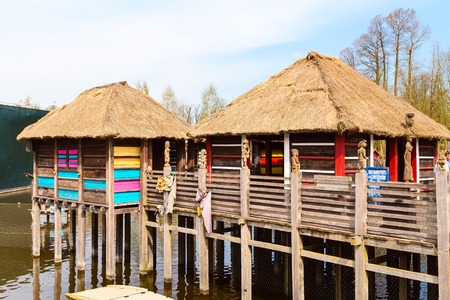 Thai village huts on the water at Pairi Daiza, Belgiumの写真素材