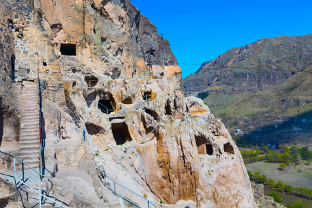 Vardzia cave monastery and ancient city in mountain rocks aerial panorama, Georgiaの写真素材