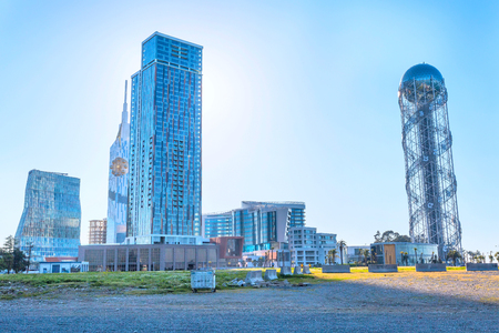 Batumi, Georgia - May 2, 2017: City view with nice modern high buildings, street with palm trees at summer Black sea resortのeditorial素材