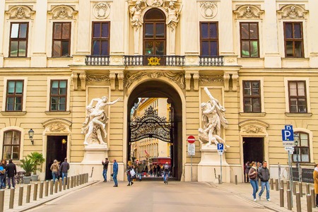 Vienna, Austria - April, 2, 2015: Arch and building view and tourists at Hofburgのeditorial素材
