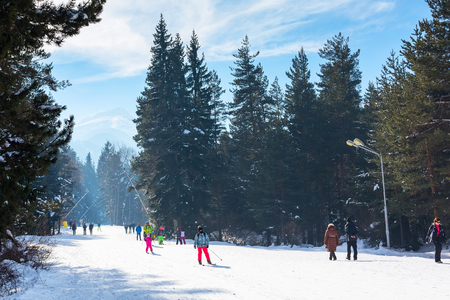 Bansko, Bulgaria - January 13, 2017: Winter ski resort Bansko, ski slope, people skiing and mountains viewのeditorial素材
