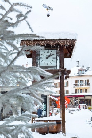 Chamonix, France - January 30, 2015: Street view with clock, cafe and central square in Chamonix, one of the oldest ski resorts in French Alpsのeditorial素材