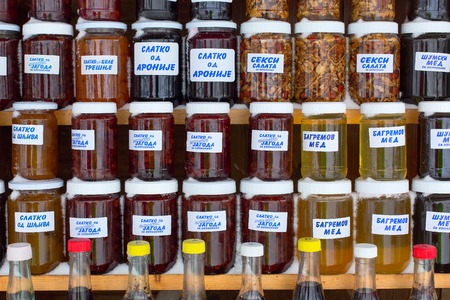 Kopaonik, Serbia - January 18, 2016: Chutney and honey jars made of various fruit types in specialty Serbian marketのeditorial素材