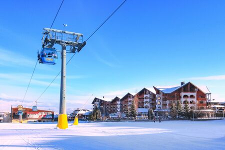 Bansko, Bulgaria - January 22, 2018: Winter ski resort Bansko with ski slope, lift cabins, people and mountains viewのeditorial素材