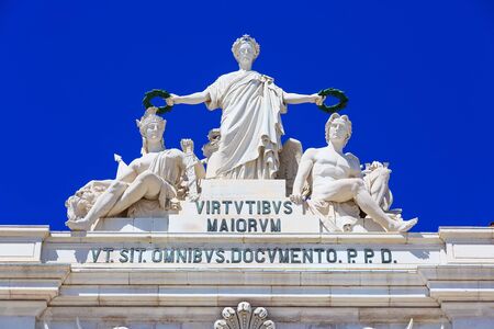 Lisbon, Portugal - March 27, 2018: Commerce square, Rua Augusta Arch close-up of the statues by Celestin Anatole Calmels: Glory rewarding Valor and Geniusのeditorial素材