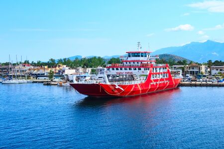 Keramoti, Greece - May 5, 2018: Keramoti port and town view with ferry boat going to Thassos islandのeditorial素材