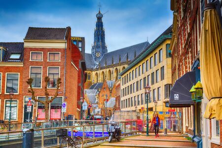 Haarlem, Netherlands - April 2, 2016: Street view with people, bicycles and cathedral in Haarlem, Hollandのeditorial素材