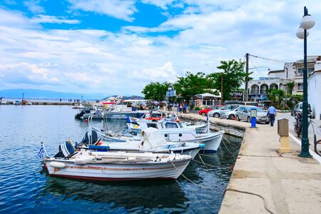 Thassos, Greece - May 5, 2018: Thasos port with boats and promenade viewのeditorial素材