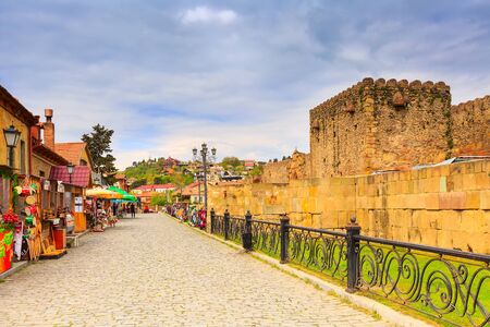 Mtskheta, Georgia - April 28, 2017: Street view with gift souvenir shops in old historical landmark...