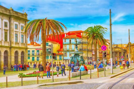 Porto, Portugal -April 1, 2018: Old town street view with colorful houses, The Fountain of the Lions, people at downtown squareのeditorial素材