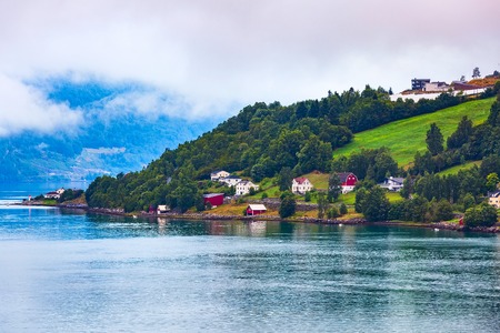 Norwegian fjord village and Sognefjord landscape in Flam, Norway. Tourism vacation and travel backgroundの写真素材
