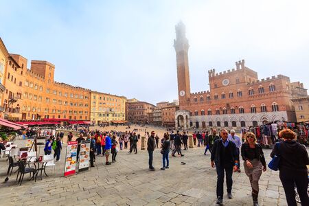 Siena, Italy - October 25, 2018: Panorama of Campo Square or Piazza del Campo with Tower Torre del Mangia and people in Tuscany townのeditorial素材