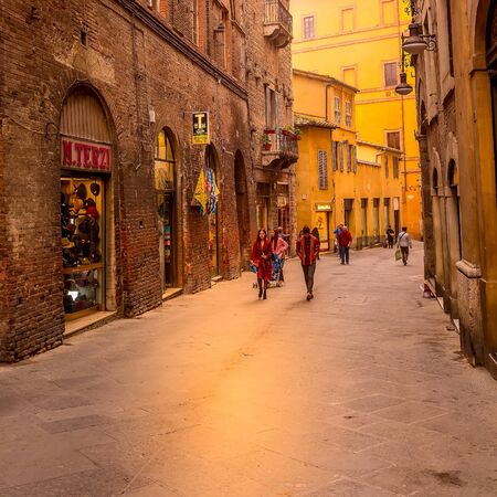 Siena, Italy - October 25, 2018: Landmark of Tuscany Siena medeival town, street view and peopleのeditorial素材