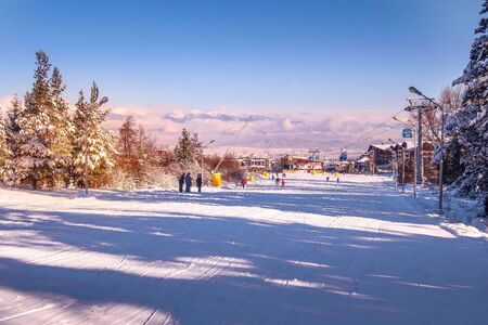 Bansko, Bulgaria - January 22, 2018: Winter ski resort Bansko with ski slope, lift cabins, people and mountains viewのeditorial素材