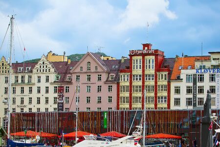 Bergen, Norway - July 30, 2018: City street view with colorful traditional houses, boats on waterのeditorial素材