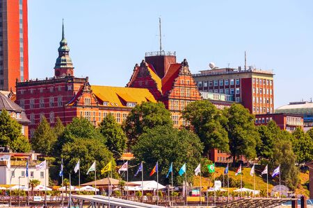 Hamburg, Germany - July 26, 2018: City skyline view of Elbe river with harbor, market and modern red housesのeditorial素材