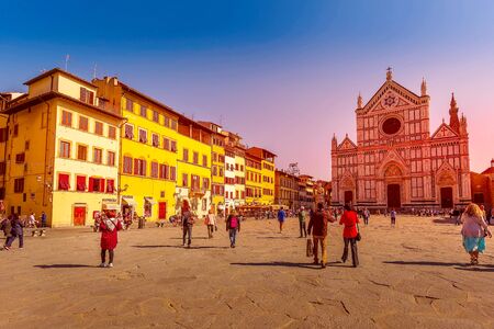 Florence, Italy - October 24, 2018: Street view with Basilica Santa Croce, houses in historical old town center at sunsetのeditorial素材