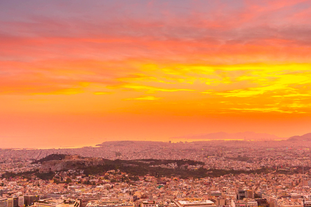 Sunset Athens aerial skyline view, Greece with sea and colorful skyの写真素材
