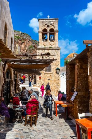Monemvasia, Greece - March 31, 2019: Street view with old houses and greek restaurant tavern in ancient town, Peloponneseのeditorial素材