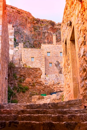 Monemvasia sunset street view with old houses in ancient town, Peloponnese, Greeceの写真素材