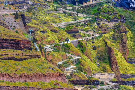 Fira, Santorini island, Greece panoramic view, with donkey path and cable car from old port, high volcanic rocksの写真素材