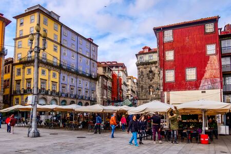 Porto, Portugal -April 1. 2018: Old town Ribeira promenade view and peopleのeditorial素材