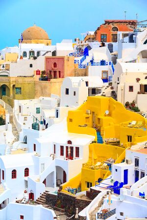 Oia, Santorini, Greece famous village town in Cyclades island with colorful houses and church dome viewの写真素材