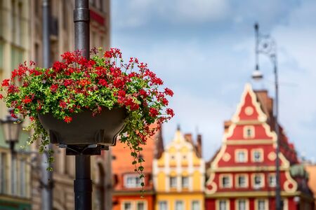 Wroclaw, Poland beautifill street light flowers and Old town market square colorful housesの写真素材