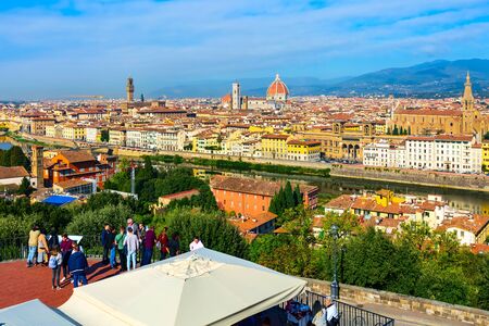 Florence, Italy - October 24, 2018: People at Piazzale Michelangelo and aerial view of historical medieval buildings with Duomo Santa Maria Del Fiore dome in old townのeditorial素材