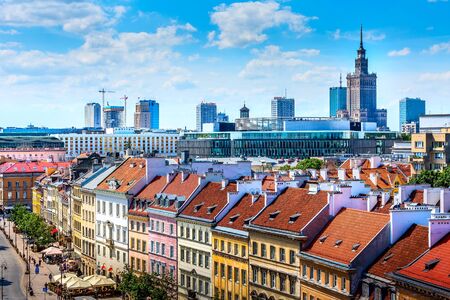 Warsaw, Poland - June 24, 2019: Modern skyscrapers and old colorful houses street view in Old Town of polish capital skyline aerial viewのeditorial素材