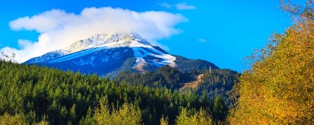 Pirin snow peaks mountains panorama and colorful autumn trees, Bansko, Bulgaria