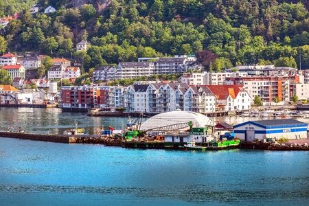 Bergen, Norway - July 30, 2018: City view from the sea with Bryggen harbor, port and colorful traditional housesのeditorial素材