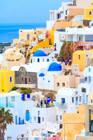 Oia, Santorini - April 25, 2019: Famous village in cyclades Island with colorful houses and touristsのeditorial素材