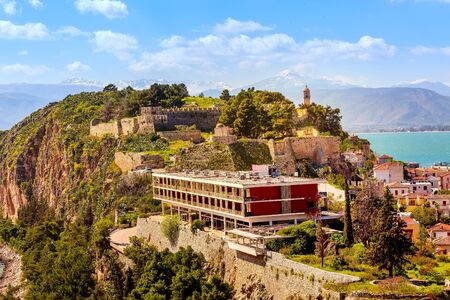 Nafplio, Greece - March 30, 2019: Peloponnese old town aerial panorama with church tower, sea and snow mountain peaksのeditorial素材
