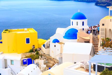 Oia, Santorini, Greece - April 25, 2019: Famous town, village panoramic view with blue church dome and colorful housesのeditorial素材