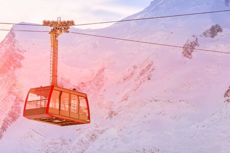 Cable car and pink sunset snow mountains panorama of French Alps near Chamonix Mont-Blanc, Franceの写真素材