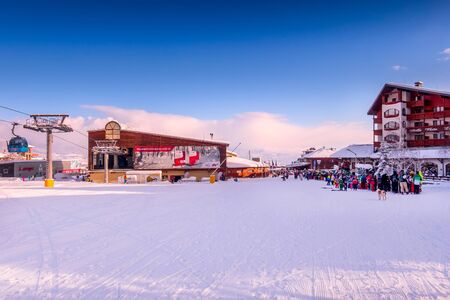 Bansko, Bulgaria - February 28, 2018: Bansko ski station, cable car lift and people queueのeditorial素材