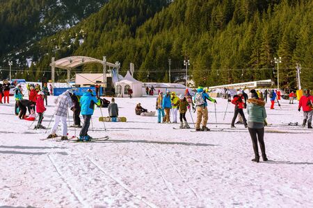 Bansko, Bulgaria - December 16, 2017: Ski resort Bansko, ski slope with people walking and skiing during season open dayのeditorial素材