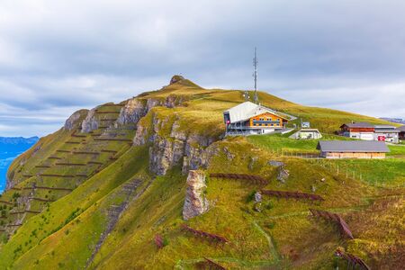 Grindelwald, Switzerland - October 10, 2019: Panoramic view of the Swiss Alps with Mannlichen cable car station, Bernese Oberland and avalance fencesのeditorial素材