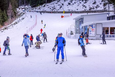 Bansko, Bulgaria - December 16, 2017: Winter ski resort Bansko, ski slope view with skiers and snowboardersのeditorial素材