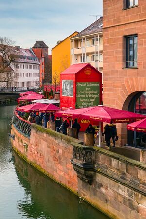 Nuremberg, Germany - December 24, 2016: Christmas market with kiosks and stalls, people in Nuremberg Bavariaのeditorial素材