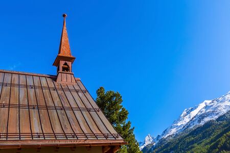 Zermatt, Switzerland St Peter anglican church, snow mountains and blue sky, copy spaceの写真素材