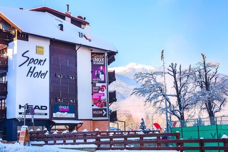 Bansko, Bulgaria - December 5, 2019: Street view, Sport hotel and Pirin snow mountain peak in bulgarian ski resortのeditorial素材