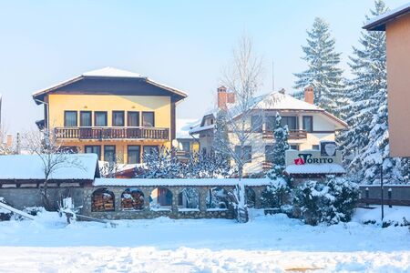 Bansko, Bulgaria - December 5, 2019: Street view, traditional houses and El Torito restaurant in bulgarian ski resortのeditorial素材