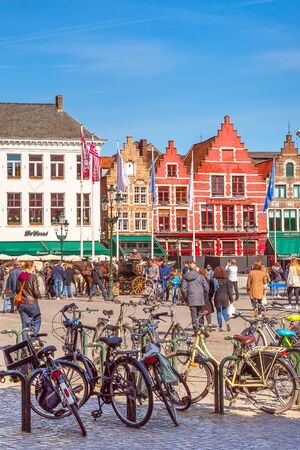 Bruges, Belgium - April 10, 2016: Market place or Grote Markt square with colorful traditional houses, people in popular belgian destinationのeditorial素材