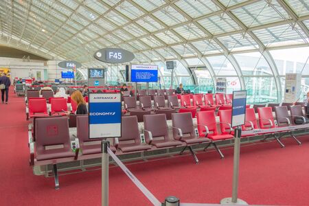 Paris, France - April 4, 2018: Charles de Gaulle airport, passengers are waiting for their flight at...
