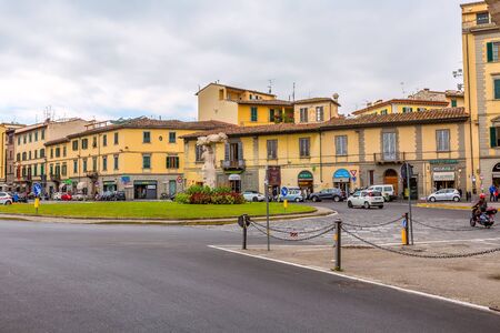 Florence, Italy - October 24, 2018: Old town street view with yellow traditional houses in Tuscanyのeditorial素材